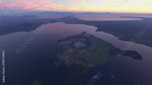 Top aerial drone view at dusk of Taal Volcano and Vulcan Point in Volcano Island. Philippines