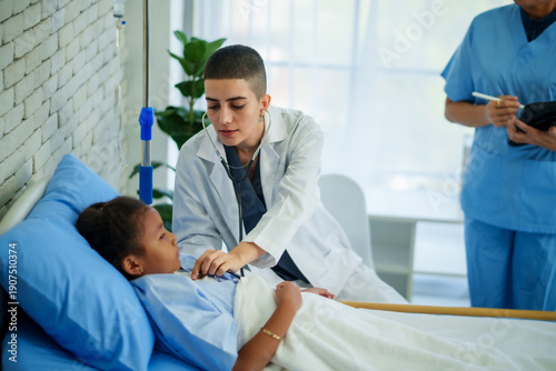 Compassionate doctor young patient hospital bed medical care stethoscope exam nurse pediatric ward recovery room healthcare team caring support create calm hopeful mood during clinical checkup
