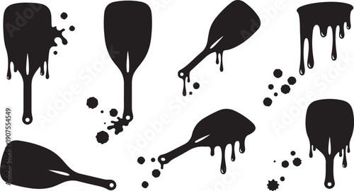 Black paintbrushes with drips and splatters on white background