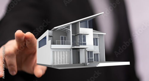 A person holds a model of a...