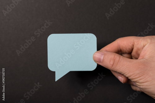 Hand holding a light blue s...