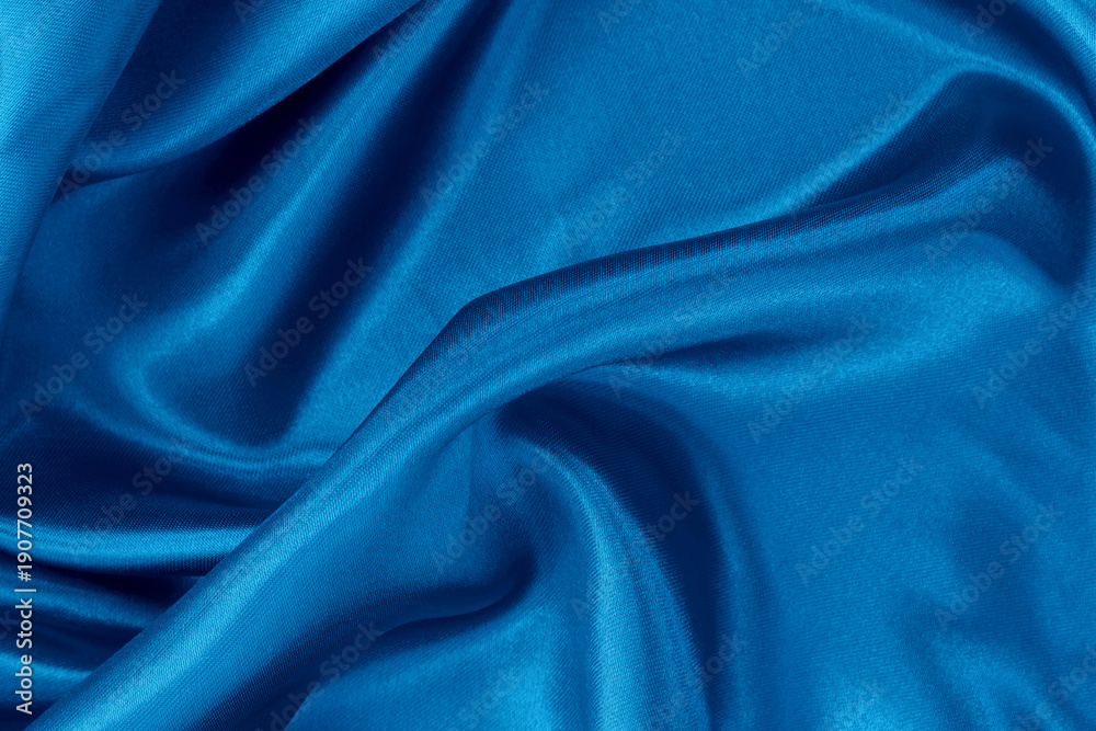 Fototapeta premium Blue fabric cloth texture for background and design art work, beautiful crumpled pattern of silk or linen.