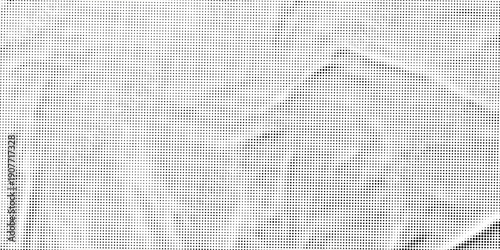 Abstract monochrome halftone texture featuring dense black dots on a white background.