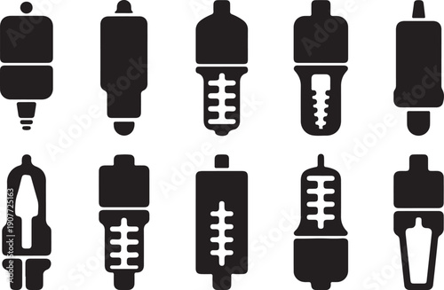 A collection of various spark plug designs and types in black and white