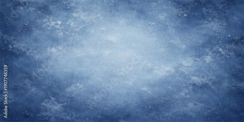 A dark blue grunge texture merges with a stormy cloudscape and abstract light to create a dramatic nature background featuring a moody blue sky filled with white clouds and heavy air