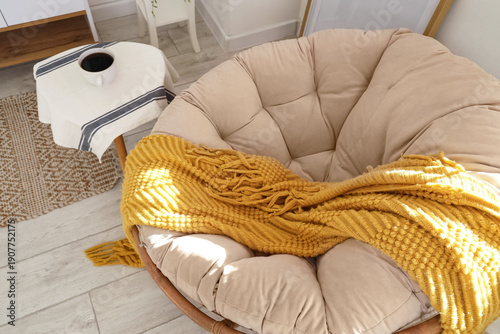 Big cozy wicker armchair wi...