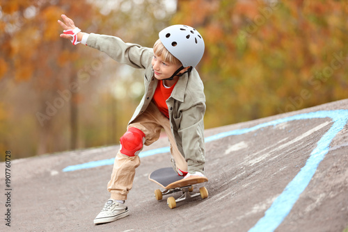 Little boy with helmet ridi...