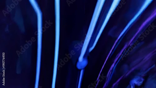 An abstract, neon-blue circuit board design glows on a dark background