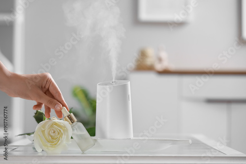 Female hand with rose flowe...