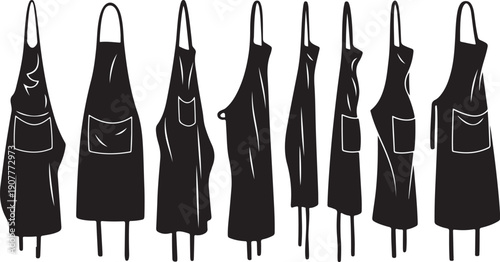 Collection of black aprons with various pocket designs shown