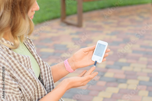 Diabetic woman using glucom...