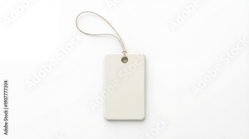 Blank white tag with string on white background.
