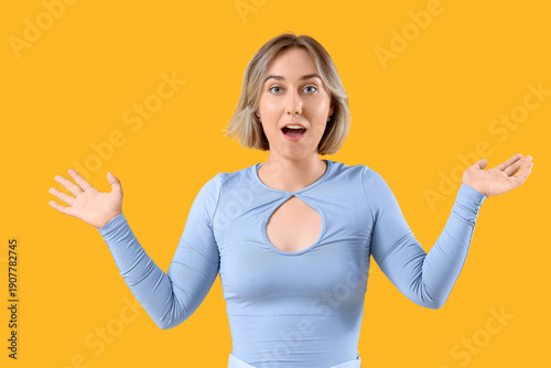 Surprised young woman on ye...