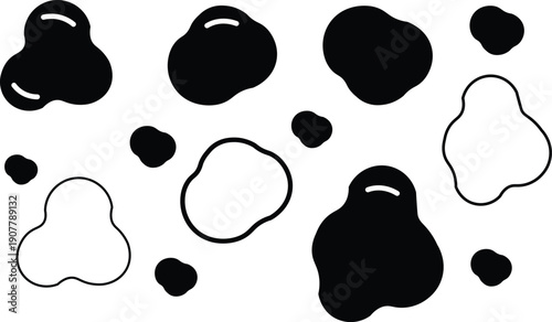 Collection of irregular organic black and white cow print blobs and abstract spots.
