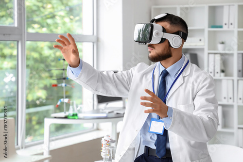 Male doctor using VR glasse...