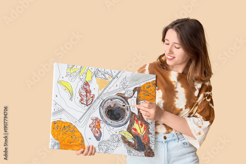 Young woman with painting b...