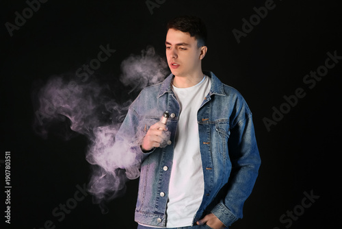 Young man smoking electroni...