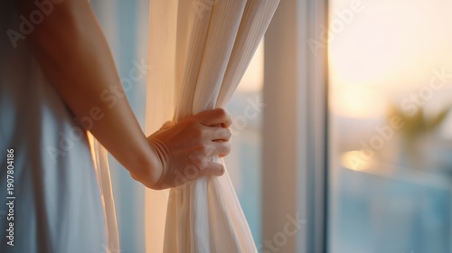 Wallpaper Mural A Serene Morning Scene: A Hand Gently Parting Sheer Curtains to Reveal a Glowing Sunrise Over a Tranquil Outdoor Space Torontodigital.ca