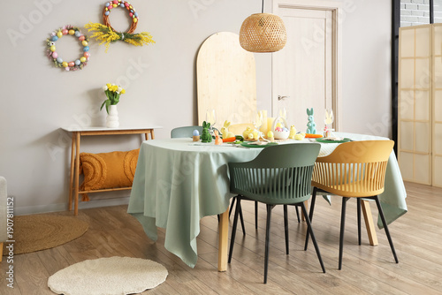 Festive table setting for Easter celebration in kitchen