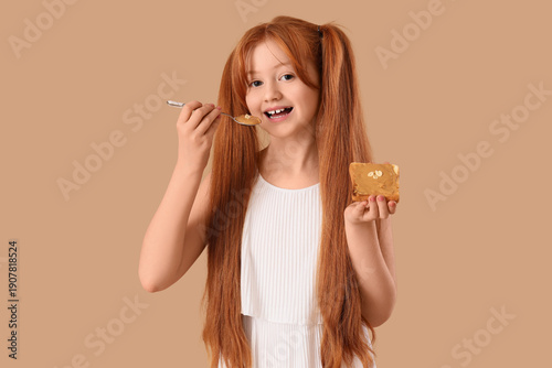 Teenage redhead girl eating...