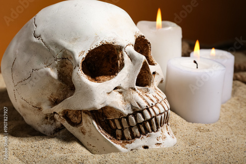 Human skull with burning ca...