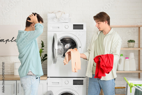 Shocked male students doing...