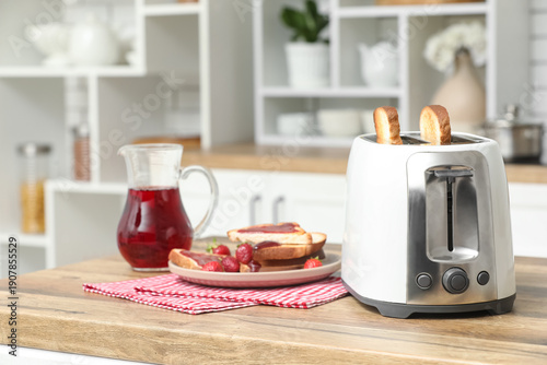 White toaster and plate wit...