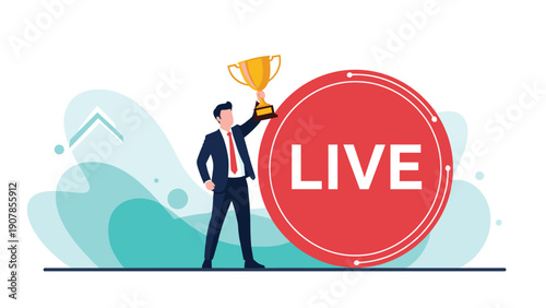 Successful businessman holding a gold trophy high while standing next to a large circular red live button for broadcast achievements.