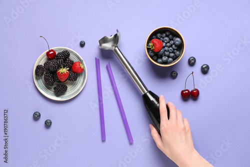Female hand, blender and di...