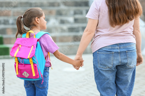 Little schoolgirl with her ...
