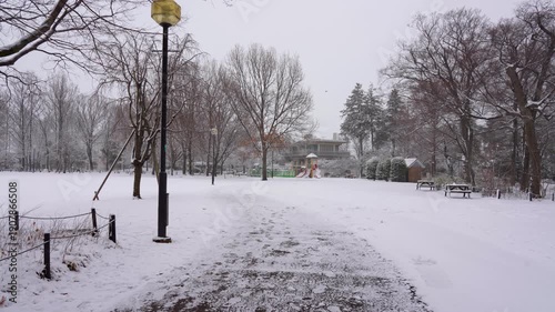 Wallpaper Mural Snow Falling Over a Peaceful Park in Tokyo City Torontodigital.ca