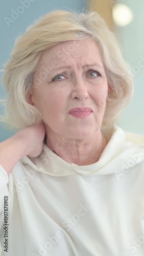 Portrait of Tired Senior Old Woman with Neck Pain, vertical video