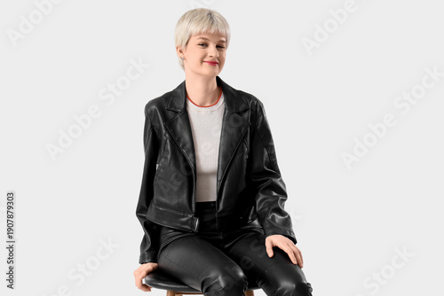 Stylish young woman in leat...
