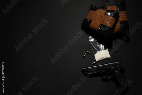 Drug packages with gun and ...
