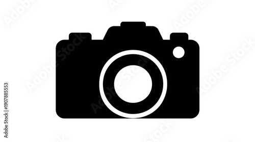 Black and white silhouette icon of a camera with a lens. It is used in photography