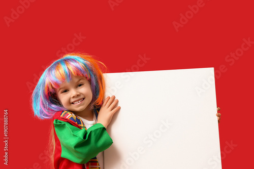 Smiling girl in clown costu...