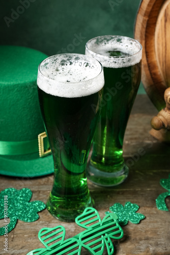 Glasses of beer with clover...