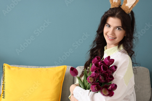 Young woman in bunny ears w...