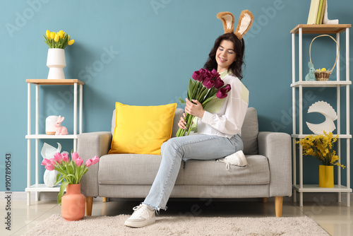Young woman in bunny ears w...