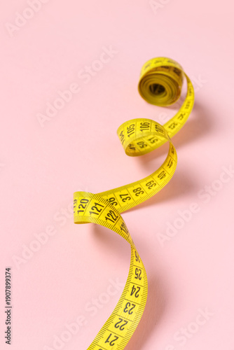 Yellow measuring tape on pi...