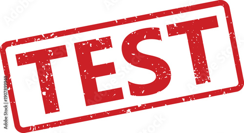 A rectangular red rubber stamp impression showing the word TEST on a clean white surface