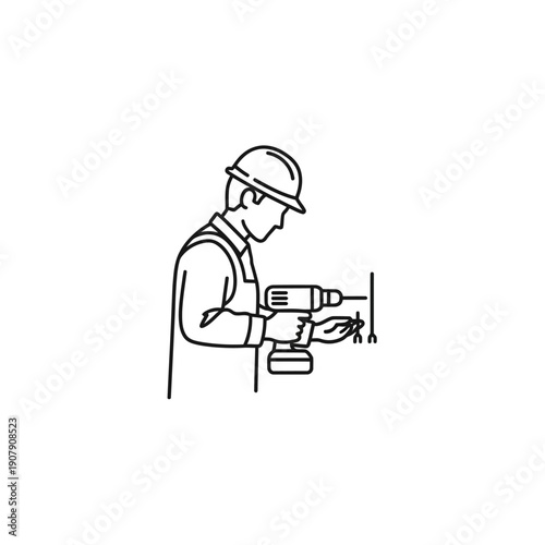 Handyman using an electric power drill to make holes in a wall
