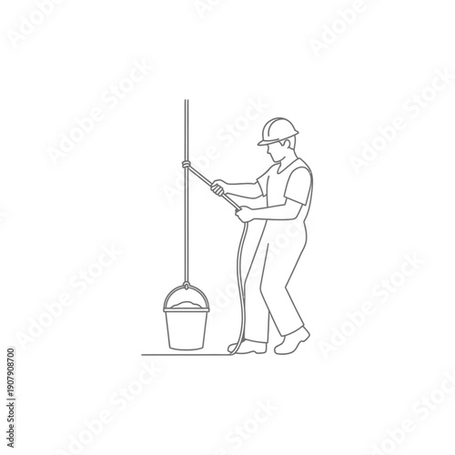 Hoisting worker pulling a rope attached to a heavy bucket