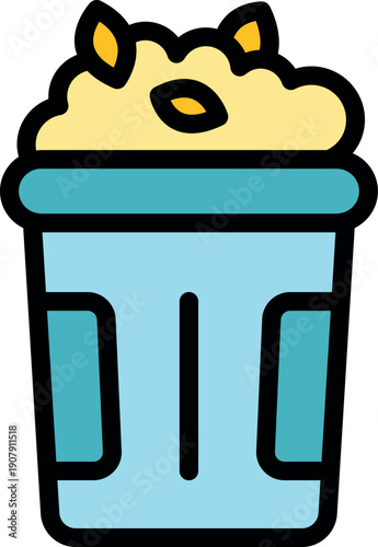 Popcorn and autumn leaves overflowing a trash can, suggesting cleaning up after an outdoor movie night