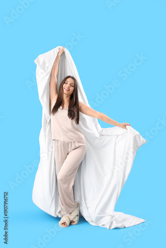 Young woman in pajamas with...