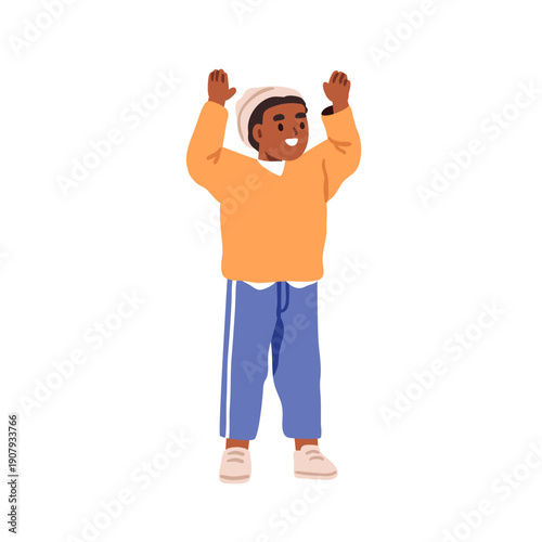 Happy excited boy with arms raised. Smiling black kid, little child standing ...