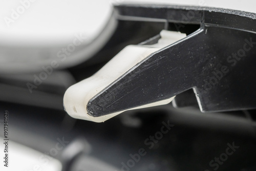 Valokuva close up view of plastic clip on car dashboard