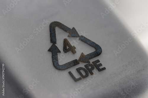 close up shot of plastic recycle symbol also known as resin identification symbol, LDPE 4. LDPE stand for low density polyethylene .