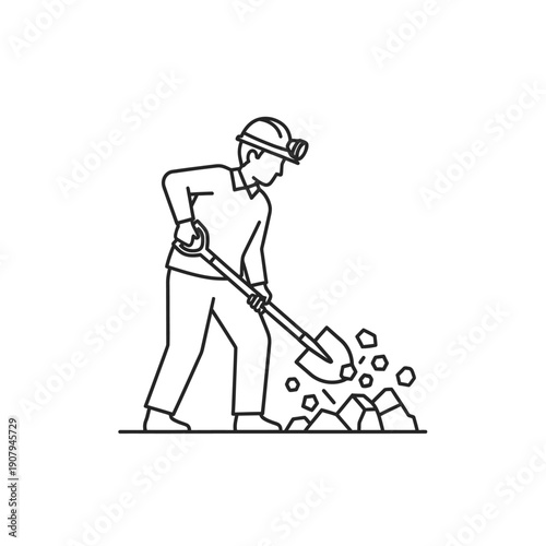 Underground miner shoveling pile of rocks and ore