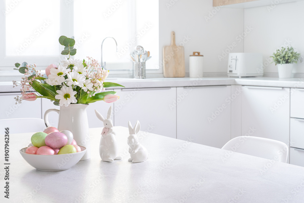 Fototapeta premium Easter decorations on table with copy space and modern kitchen counter interior